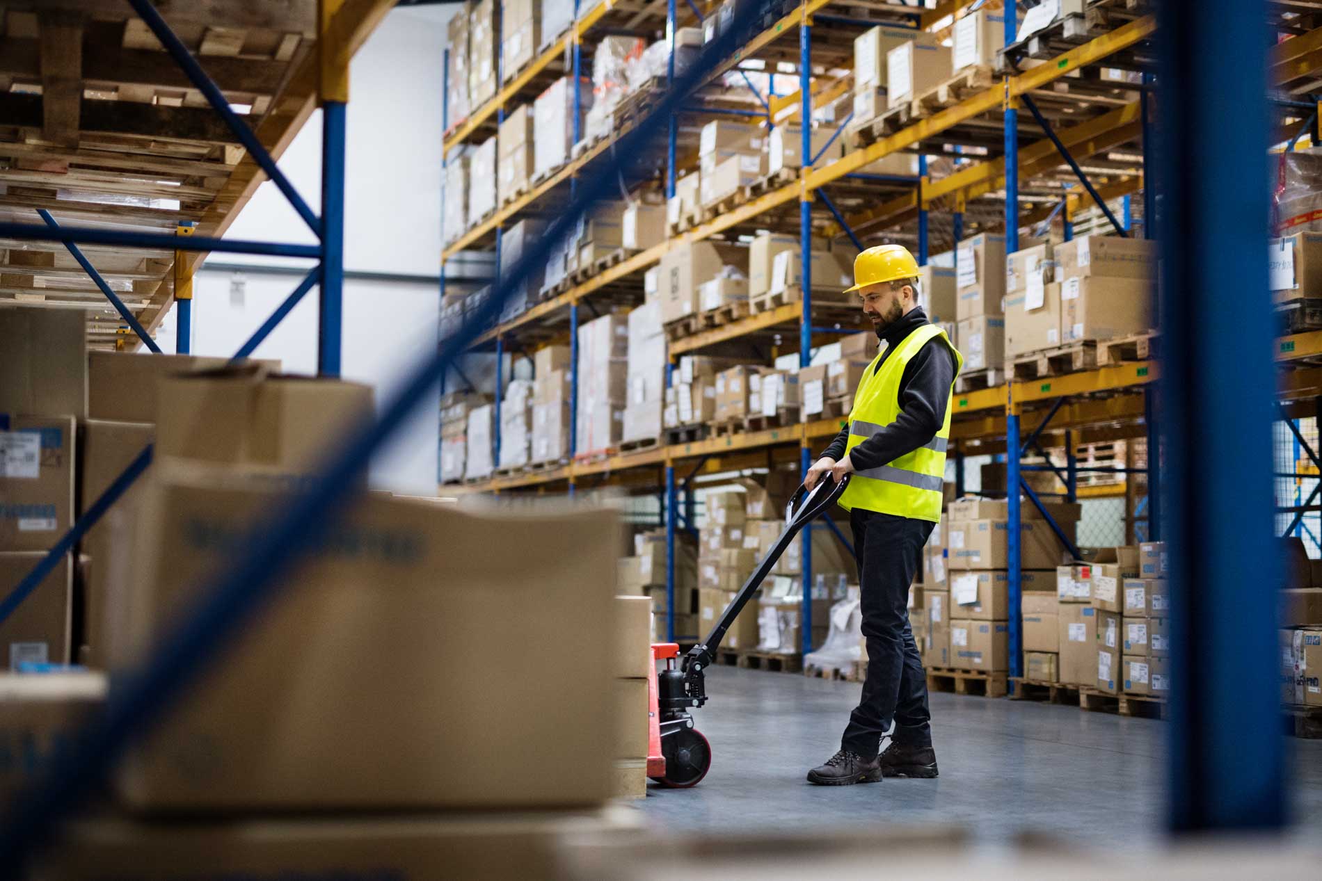 Male,Warehouse,Worker,Pulling,A,Pallet,Truck.